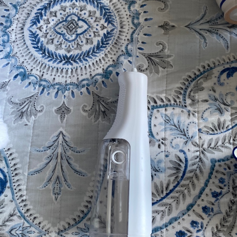 New water floss or buy waterpik. husband prefers regular floss. I love mine.